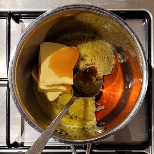 Butter, Golden Syrup and water in a pan to melt together for ANZAC biscuits